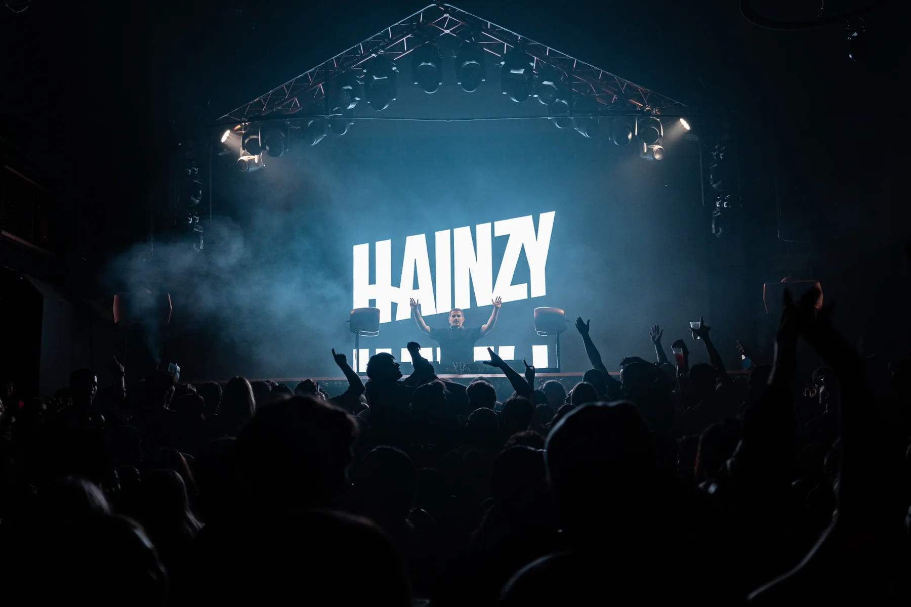 DJ performing to a crowd inside a Perth club